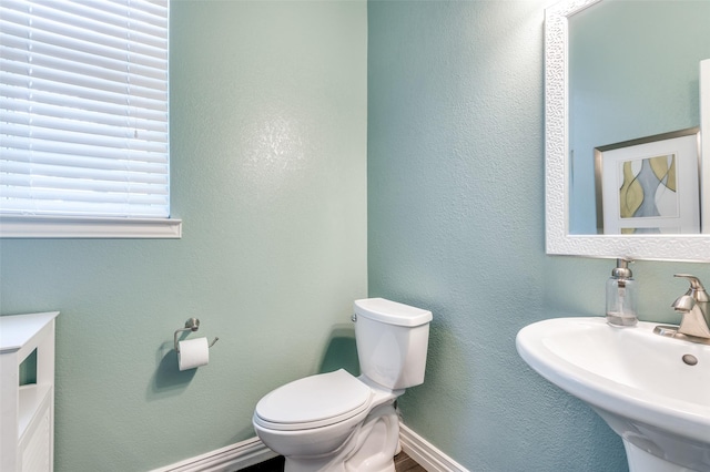 2401 Greenwich Dr, Carrollton, TX 75006 - half bath featuring a sink and toilet