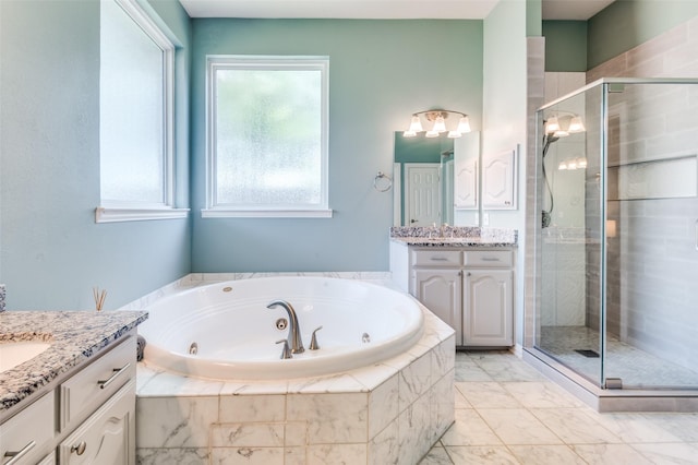 2401 Greenwich Dr, Carrollton, TX 75006 - full bathroom featuring a shower stall, two vanities, and a jetted tub