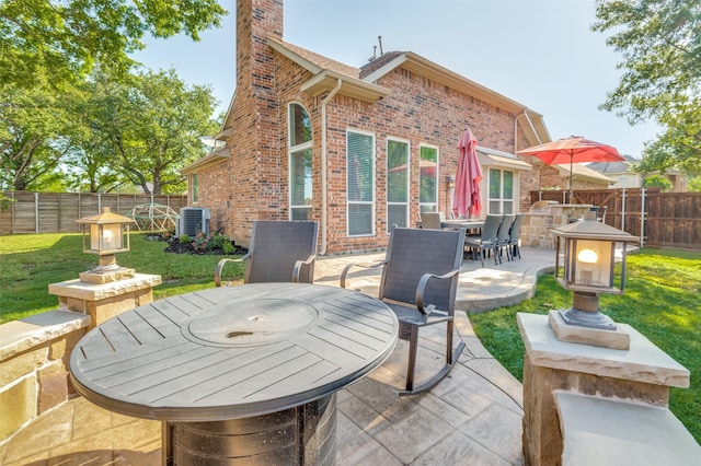 2401 Greenwich Dr, Carrollton, TX 75006 - view of patio / terrace featuring outdoor dining space and central AC unit