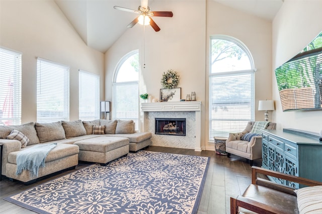 2401 Greenwich Dr, Carrollton, TX 75006 - living area with high vaulted ceiling, a ceiling fan, hardwood / wood-style floors, and a premium fireplace