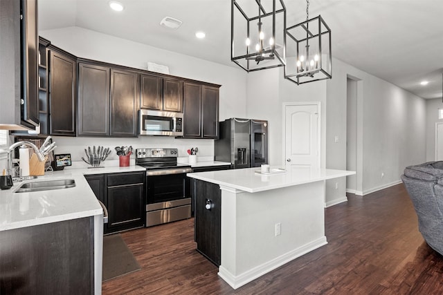10116 Mickler Ln, Waco, TX 76708 - kitchen with appliances with stainless steel finishes, a sink, a kitchen island, light countertops, and dark brown cabinetry