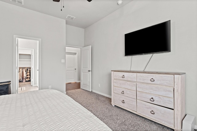 10116 Mickler Ln, Waco, TX 76708 - carpeted bedroom with a spacious closet, a ceiling fan, and baseboards