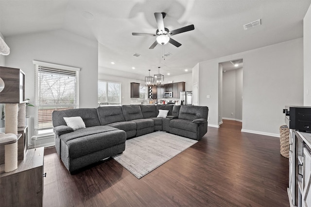 10116 Mickler Ln, Waco, TX 76708 - living room featuring ceiling fan, dark wood-type flooring, baseboards, recessed lighting, and a chandelier
