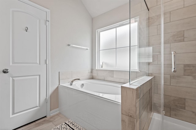 10116 Mickler Ln, Waco, TX 76708 - full bathroom with a shower stall, a bath, and vaulted ceiling