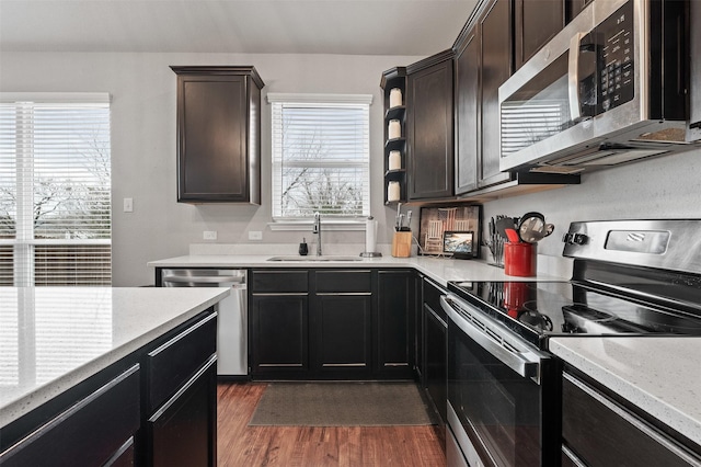 10116 Mickler Ln, Waco, TX 76708 - kitchen with stainless steel appliances, a sink, dark wood-style floors, and open shelves