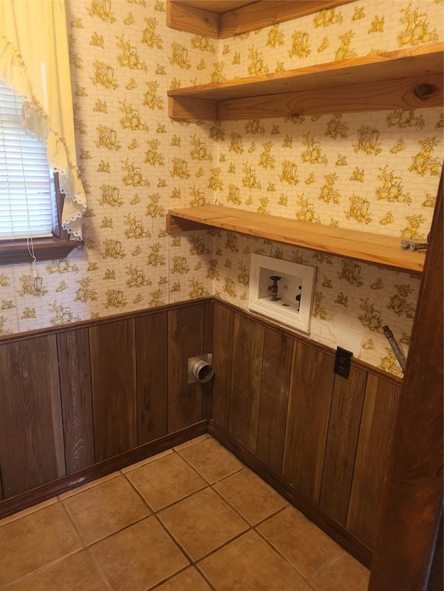 6313 Westwood Rd, Shreveport, LA 71129 - washroom with washer hookup and light tile patterned floors