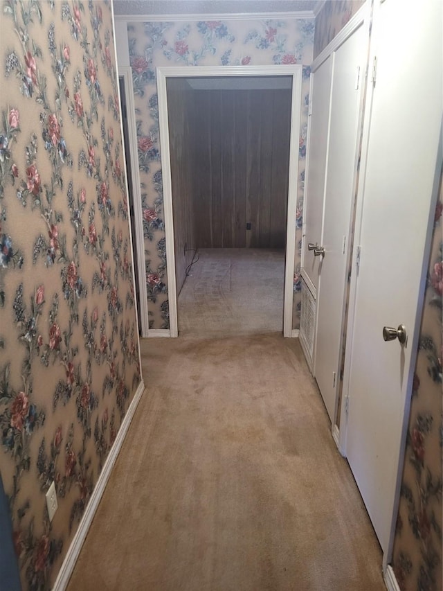 6313 Westwood Rd, Shreveport, LA 71129 - hallway featuring light colored carpet and wallpapered walls