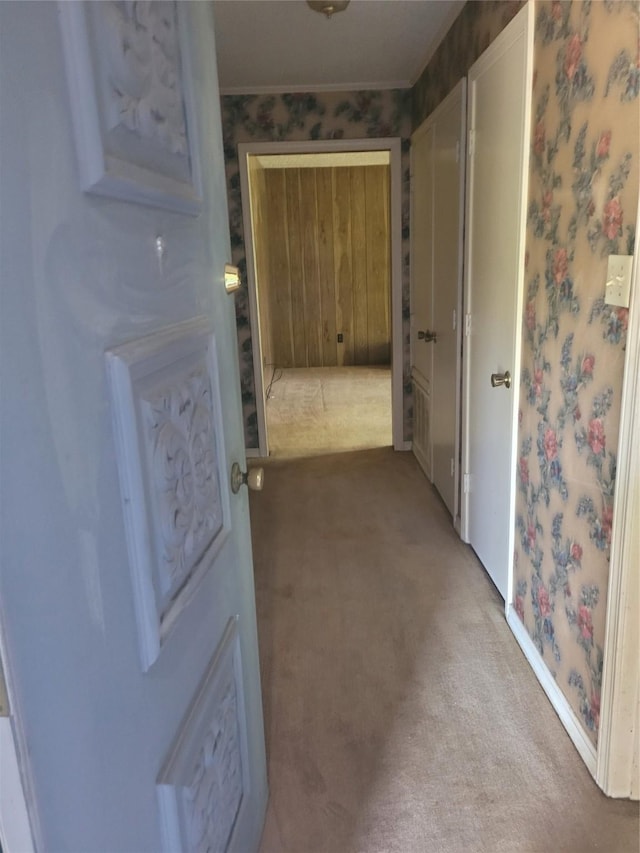 6313 Westwood Rd, Shreveport, LA 71129 - hallway with light carpet, wallpapered walls, and ornamental molding