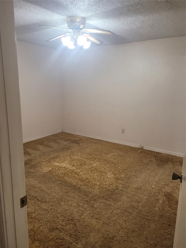 6313 Westwood Rd, Shreveport, LA 71129 - carpeted spare room with a textured ceiling, a ceiling fan, and baseboards