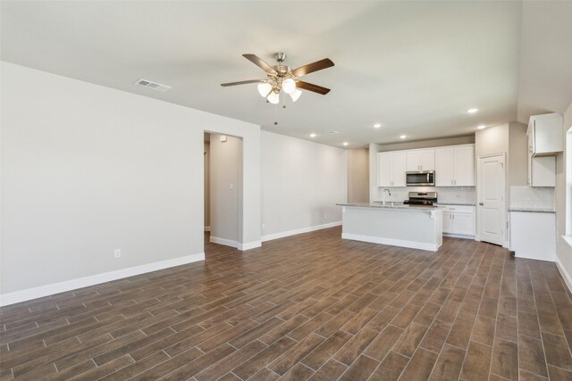 1625 Cloud Cover Vw, Weston, TX 75009 - kitchen featuring appliances with stainless steel finishes, a sink, a ceiling fan, dark wood finished floors, and open floor plan