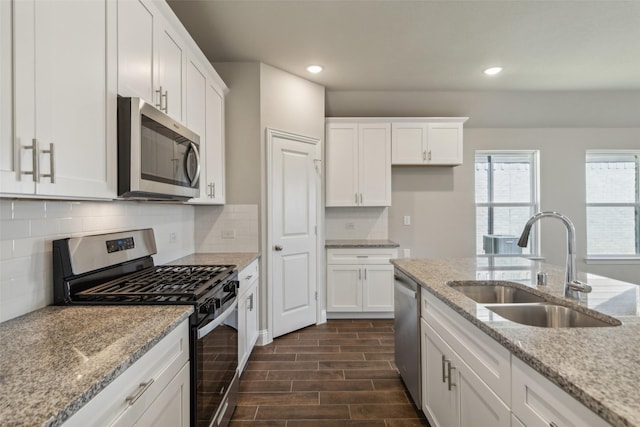 1625 Cloud Cover Vw, Weston, TX 75009 - kitchen with stainless steel appliances, a sink, white cabinets, recessed lighting, and light stone countertops