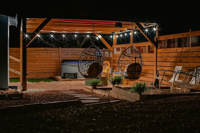 300 E 4th, Brady, TX 76825 - patio at night featuring fence
