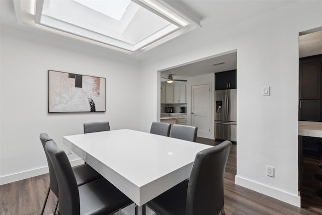 10834 Wyatt St, Dallas, TX 75218 - dining space with baseboards and dark wood-style floors