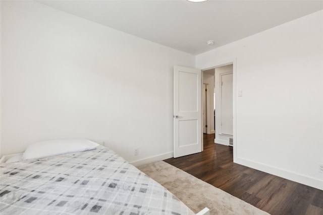 10834 Wyatt St, Dallas, TX 75218 - bedroom featuring wood finished floors and baseboards
