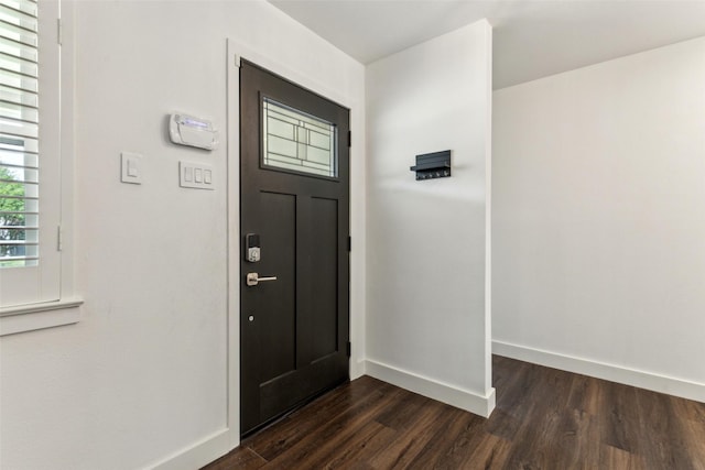 10834 Wyatt St, Dallas, TX 75218 - entryway with dark wood-style flooring and baseboards