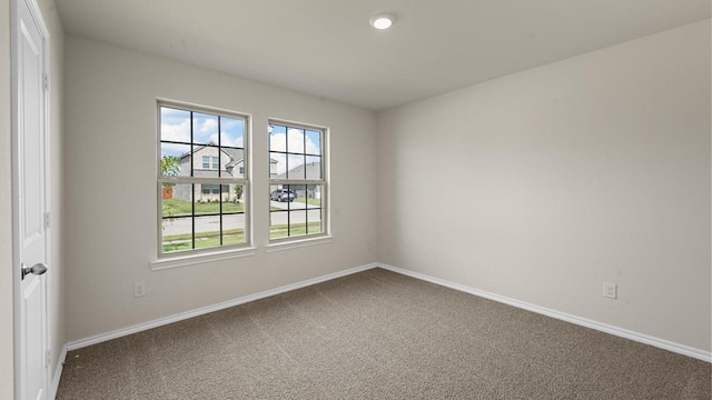440 Drake Dr, Ferris, TX 75125 - unfurnished room featuring carpet floors and healthy amount of natural light