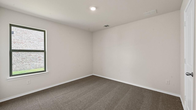 440 Drake Dr, Ferris, TX 75125 - unfurnished room featuring dark colored carpet