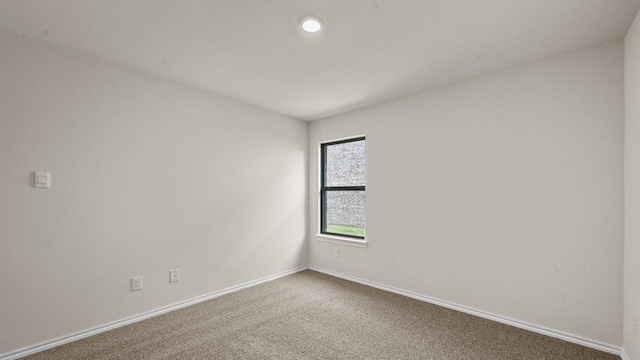 440 Drake Dr, Ferris, TX 75125 - carpeted spare room featuring baseboards