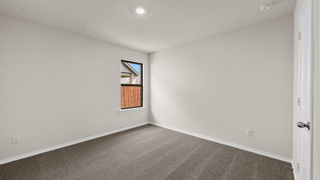 440 Drake Dr, Ferris, TX 75125 - unfurnished room featuring a smoke detector and dark carpet