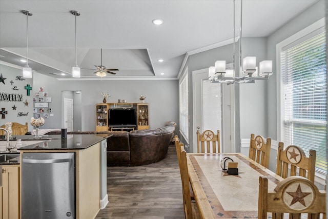 2231 Rana Park, Flint, TX 75762 - dining area with a tray ceiling, a ceiling fan, dark wood-type flooring, crown molding, and a chandelier