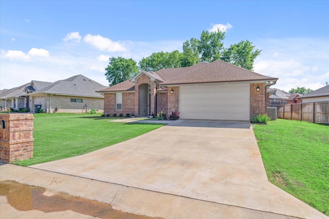 2231 Rana Park, Flint, TX 75762 - ranch-style house with central AC unit, brick siding, an attached garage, and driveway