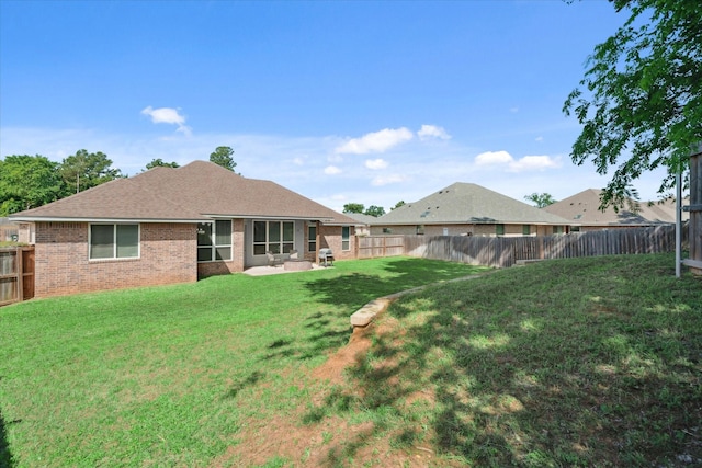 2231 Rana Park, Flint, TX 75762 - back of property featuring brick siding, roof with shingles, and a patio