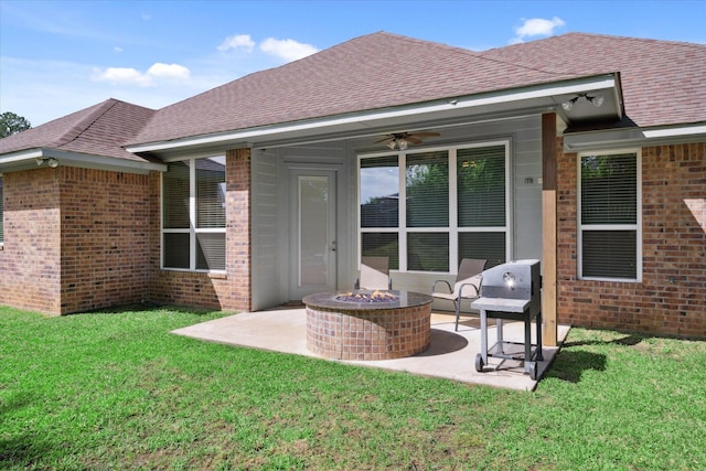 2231 Rana Park, Flint, TX 75762 - rear view of house with a fire pit, brick siding, and a patio