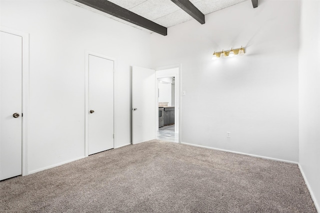 2627 Roger Williams Dr, Irving, TX 75061 - unfurnished bedroom with beamed ceiling, carpet flooring, and baseboards