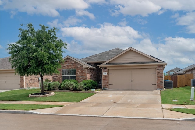 2717 Swift Creek Dr, Fort Worth, TX 76123 - ranch-style house featuring central AC unit, brick siding, a front lawn, concrete driveway, and an attached garage