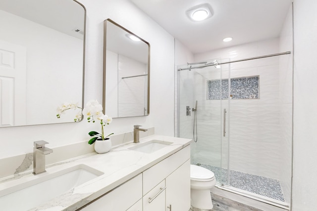 827 Astaire Ave, Duncanville, TX 75137 - bathroom featuring a stall shower, toilet, double vanity, and recessed lighting