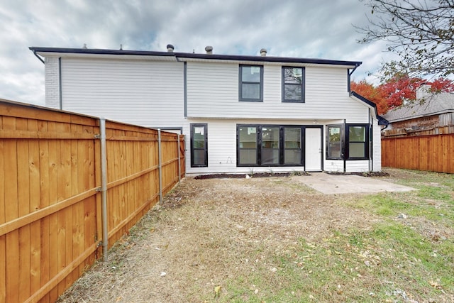 827 Astaire Ave, Duncanville, TX 75137 - back of property featuring a fenced backyard and a patio
