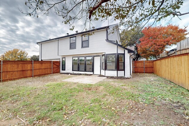 827 Astaire Ave, Duncanville, TX 75137 - back of house with a patio