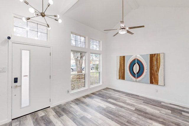 827 Astaire Ave, Duncanville, TX 75137 - foyer with high vaulted ceiling, a chandelier, wood finished floors, beam ceiling, and a ceiling fan