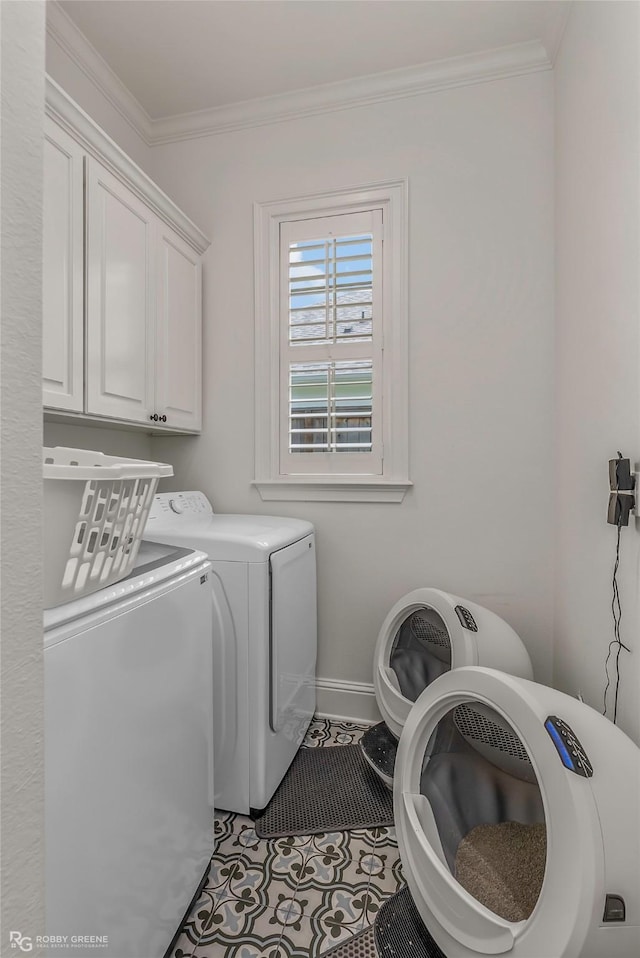 laundry room with cabinet space, washer and clothes dryer, ornamental molding, and tile patterned flooring