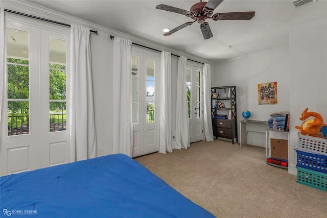 bedroom featuring carpet flooring, crown molding, and ceiling fan