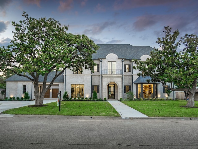 4633 Willow Ln, Dallas, TX 75244 - french country home with a front yard, a balcony, and french doors