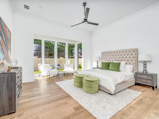 4633 Willow Ln, Dallas, TX 75244 - bedroom with crown molding, light wood finished floors, a ceiling fan, and baseboards