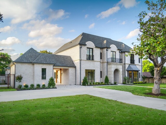 4633 Willow Ln, Dallas, TX 75244 - french country home featuring brick siding, driveway, and a shingled roof