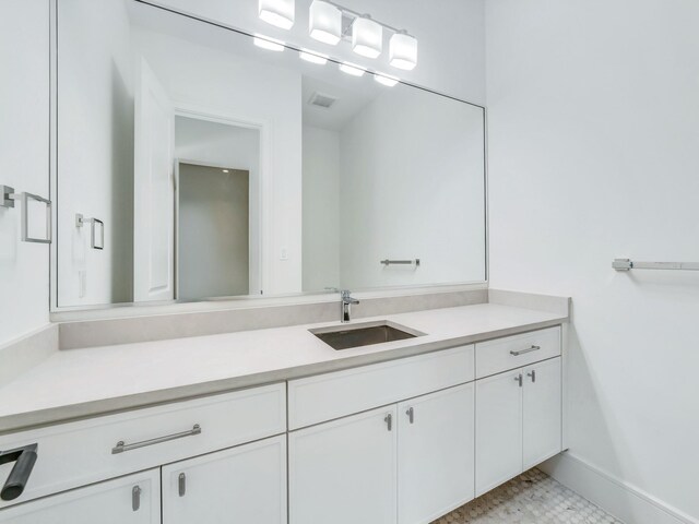 4633 Willow Ln, Dallas, TX 75244 - bathroom featuring vanity and baseboards