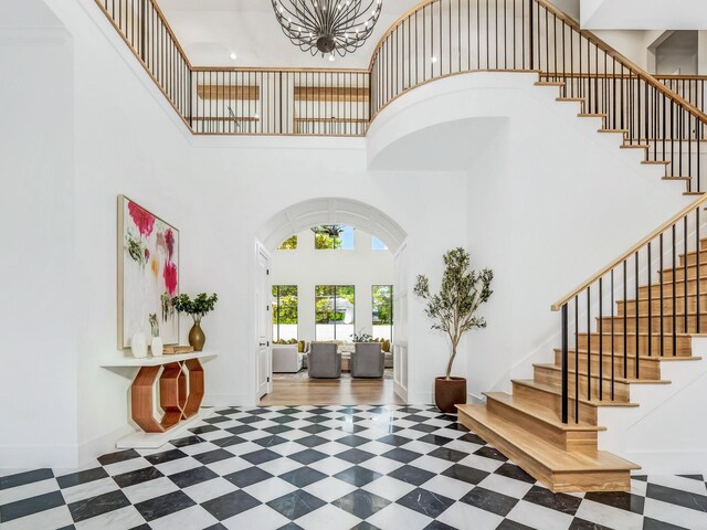 4633 Willow Ln, Dallas, TX 75244 - entryway featuring a high ceiling, arched walkways, and stairway