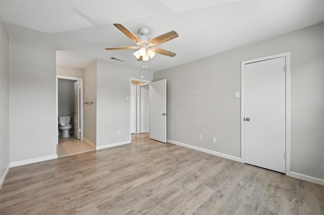 14800 Enterprise Dr Unit 17A, Farmers Branch, TX 75234 - unfurnished bedroom featuring light wood-style floors, baseboards, ensuite bath, and ceiling fan