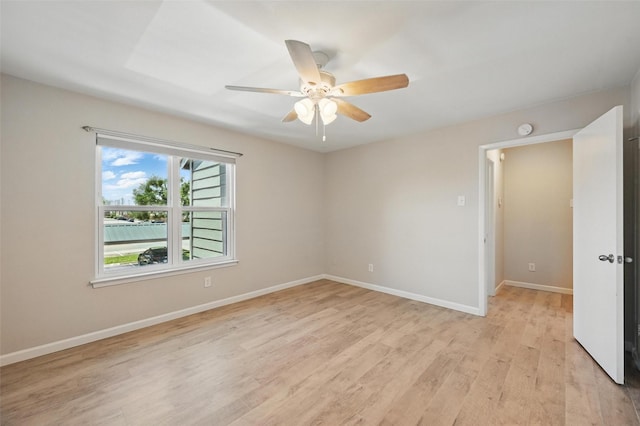 14800 Enterprise Dr Unit 17A, Farmers Branch, TX 75234 - empty room featuring light wood-style flooring, a ceiling fan, baseboards, and a smoke detector