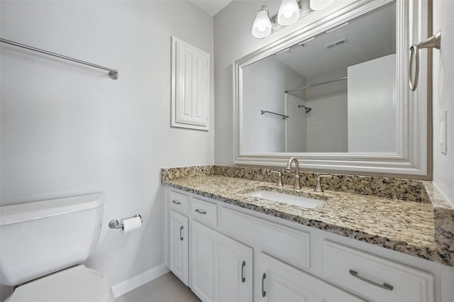 14800 Enterprise Dr Unit 17A, Farmers Branch, TX 75234 - bathroom featuring toilet, vanity, and baseboards