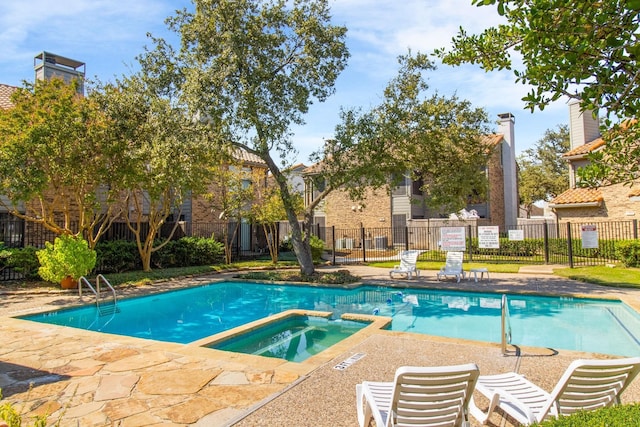14800 Enterprise Dr Unit 17A, Farmers Branch, TX 75234 - view of pool with fence, a pool with connected hot tub, and a patio area
