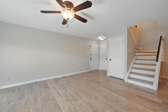 14800 Enterprise Dr Unit 17A, Farmers Branch, TX 75234 - unfurnished living room featuring stairs, light wood-type flooring, a ceiling fan, and baseboards