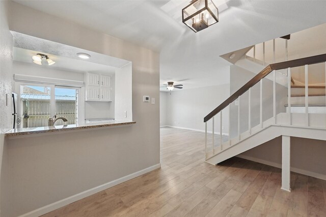 14800 Enterprise Dr Unit 17A, Farmers Branch, TX 75234 - staircase with baseboards, wood finished floors, and a ceiling fan