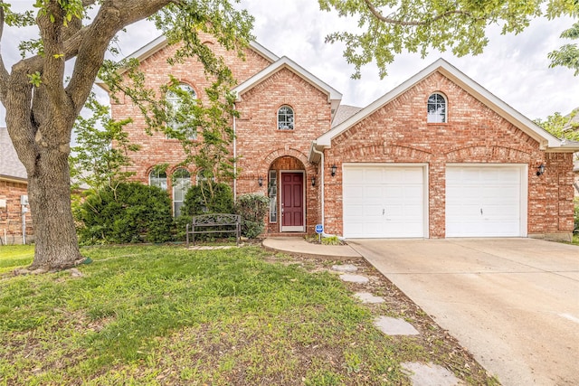 5929 Meadowcrest Ln, Sachse, TX 75048 - view of front of home with brick siding, an attached garage, driveway, and a front lawn