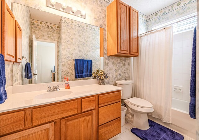 5929 Meadowcrest Ln, Sachse, TX 75048 - full bath with wallpapered walls, toilet, vanity, tile patterned flooring, and shower / tub combo
