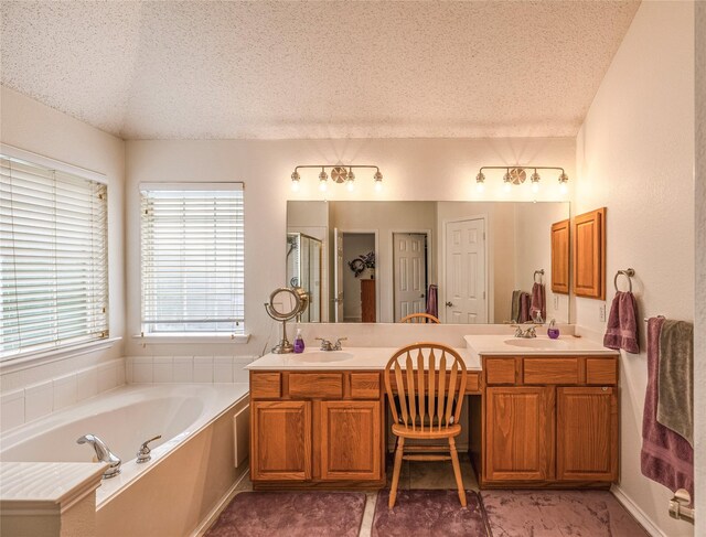 5929 Meadowcrest Ln, Sachse, TX 75048 - full bath with a textured ceiling, a garden tub, double vanity, and a shower stall