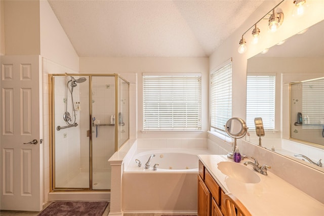 5929 Meadowcrest Ln, Sachse, TX 75048 - bathroom featuring vaulted ceiling, a stall shower, a textured ceiling, vanity, and a jetted tub